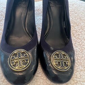 Tory Burch Navy Blue Pumps with Gold & Navy emblem.